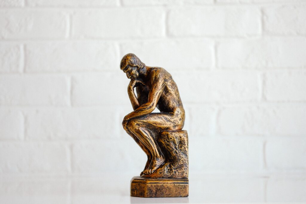 sculpture of a man lost in thought