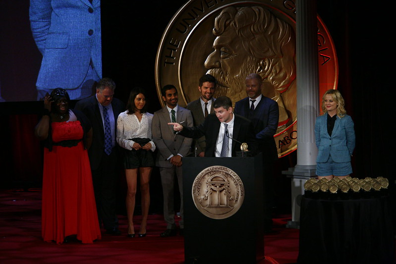 That’s a photo of the “Parks and Rec” cast receiving a Peabody Award in 2012