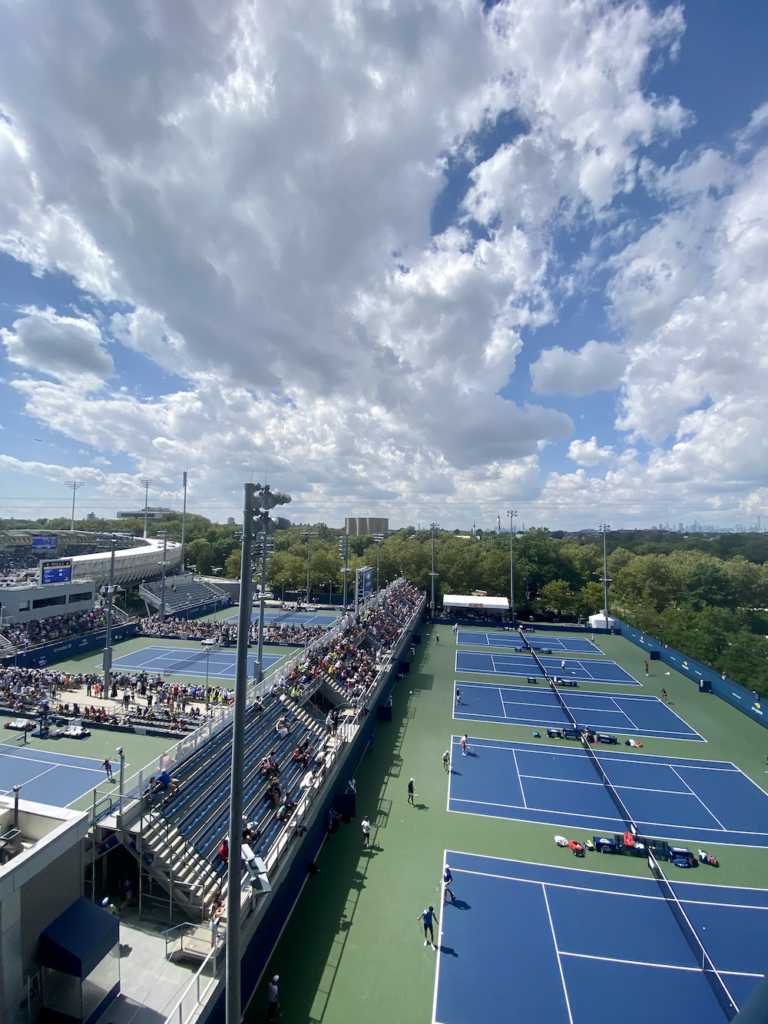 the practice courts at the US Open are on right, with more courts on the left. You can see the Grandstand, one of the biggest courts at the facility, on the far left.