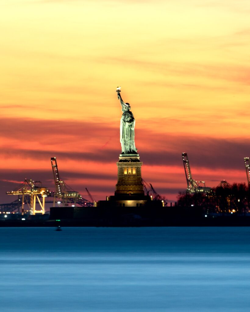 That's a photo of the Statue of Liberty, with the port in Jersey behind it, at sunset.