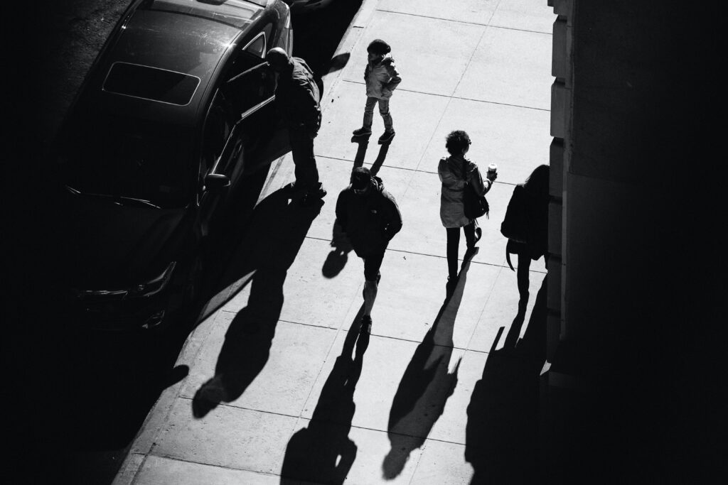 People walk down the sidewalk in Manhattan