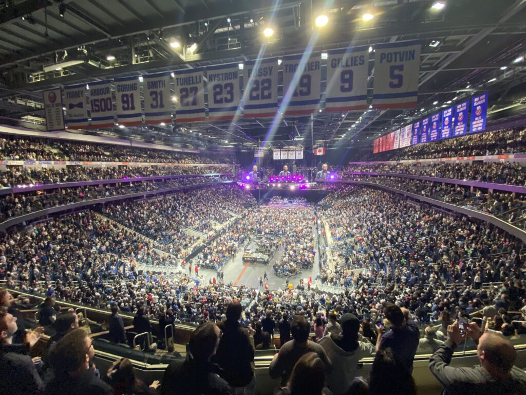 Here's a photo I took during “Born to Run” at the Bruce Springsteen & The E Street Band show on April 9, 2023, at UBS Arena. The house lights are up, and you can see the entire crowd dance and sing during the performance.