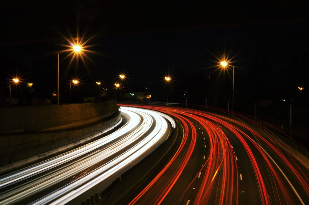 Busy freeway traffic at night.