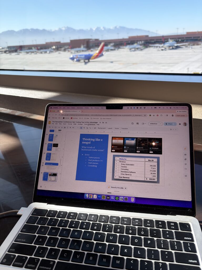 A Southwest flight taxies in the background as I work on slides at Salt Lake International Airport.